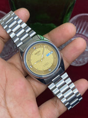 Seiko 5 “Gold Standard” — 7S26 Champagne Dial Exhibition Automatic watch.