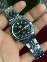 Seiko 5 SNKF67J1 Automatic — Black Sunburst Dial Watch with Exhibition Back | Ref 7S26-00X0.