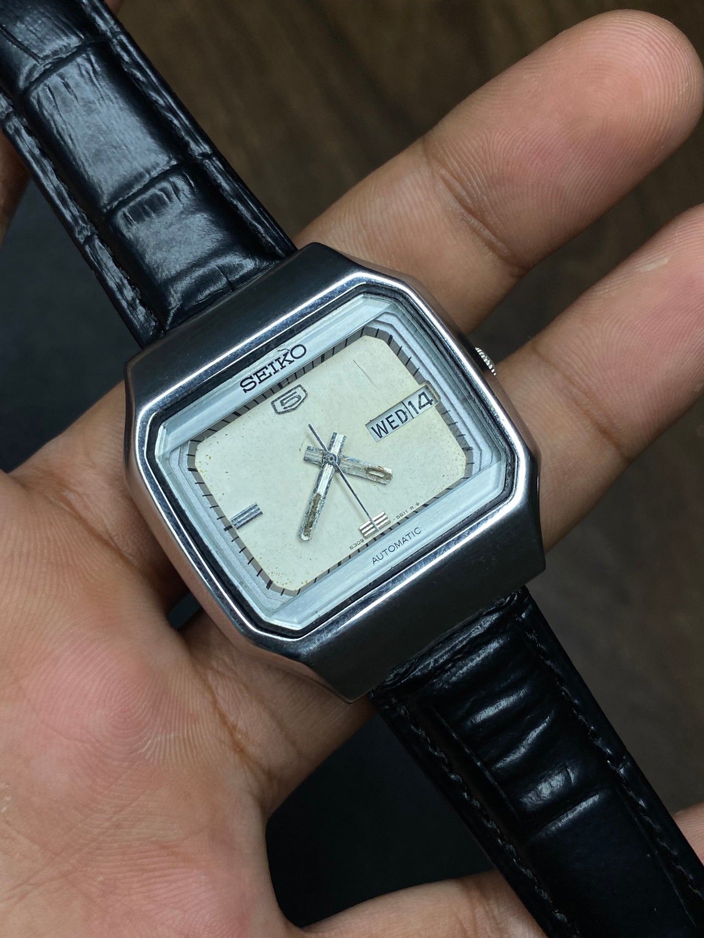Vintage 1980s Seiko 5 Light Silver Tv Dial Automatic Watch with Black Leather Strap.