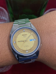 Seiko 5 “Gold Standard” — 7S26 Champagne Dial Exhibition Automatic watch.