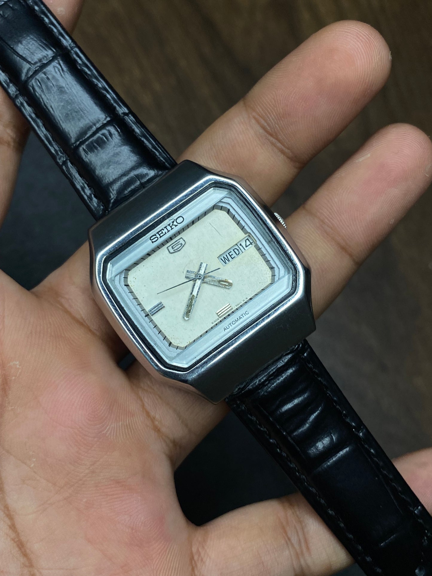Vintage 1980s Seiko 5 Light Silver Tv Dial Automatic Watch with Black Leather Strap.