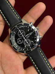 Seiko 7T92 Chronograph — Black Dial with three sub-dials and a black leather strap.

100m water resistance.
