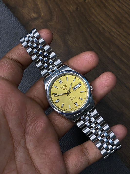 Beautiful Seiko 5 SNXS81 Golden Dial Watch With jubilee bracelet & See-Through Back