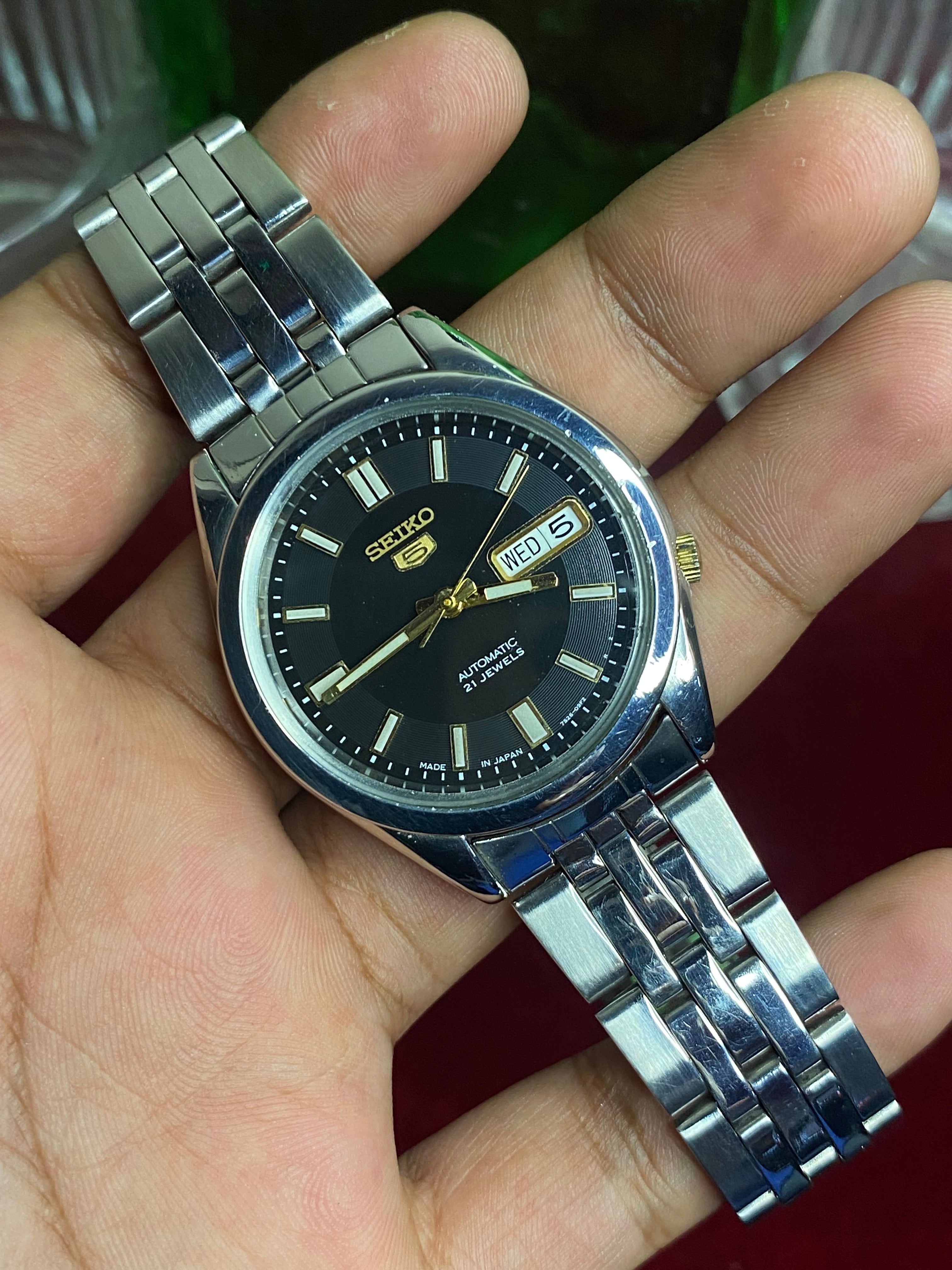 Seiko 5 SNKF67J1 Automatic — Black Sunburst Dial Watch with Exhibition Back | Ref 7S26-00X0.