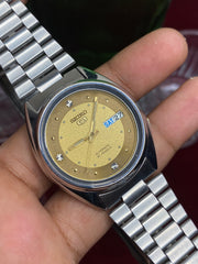 Seiko 5 “Gold Standard” — 7S26 Champagne Dial Exhibition Automatic watch.