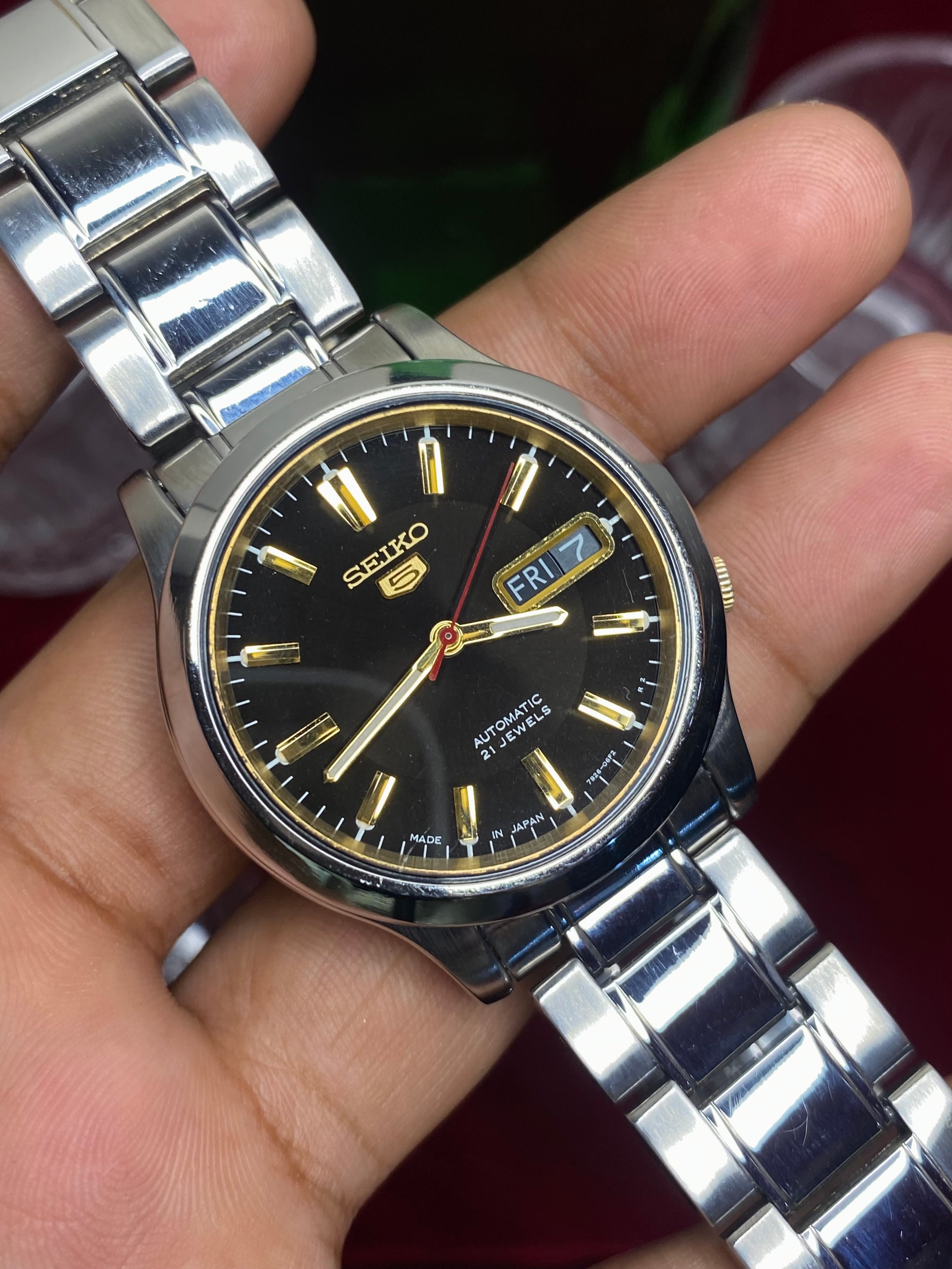 Seiko 5 Automatic — Black & Gold Dial Watch with Exhibition Back | Ref 7S26-01T0.
