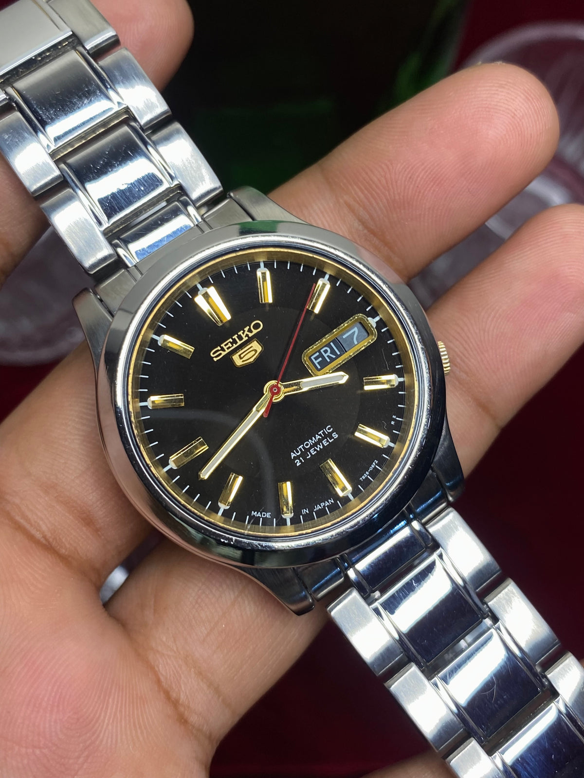 Seiko 5 Automatic — Black & Gold Dial Watch with Exhibition Back | Ref 7S26-01T0.