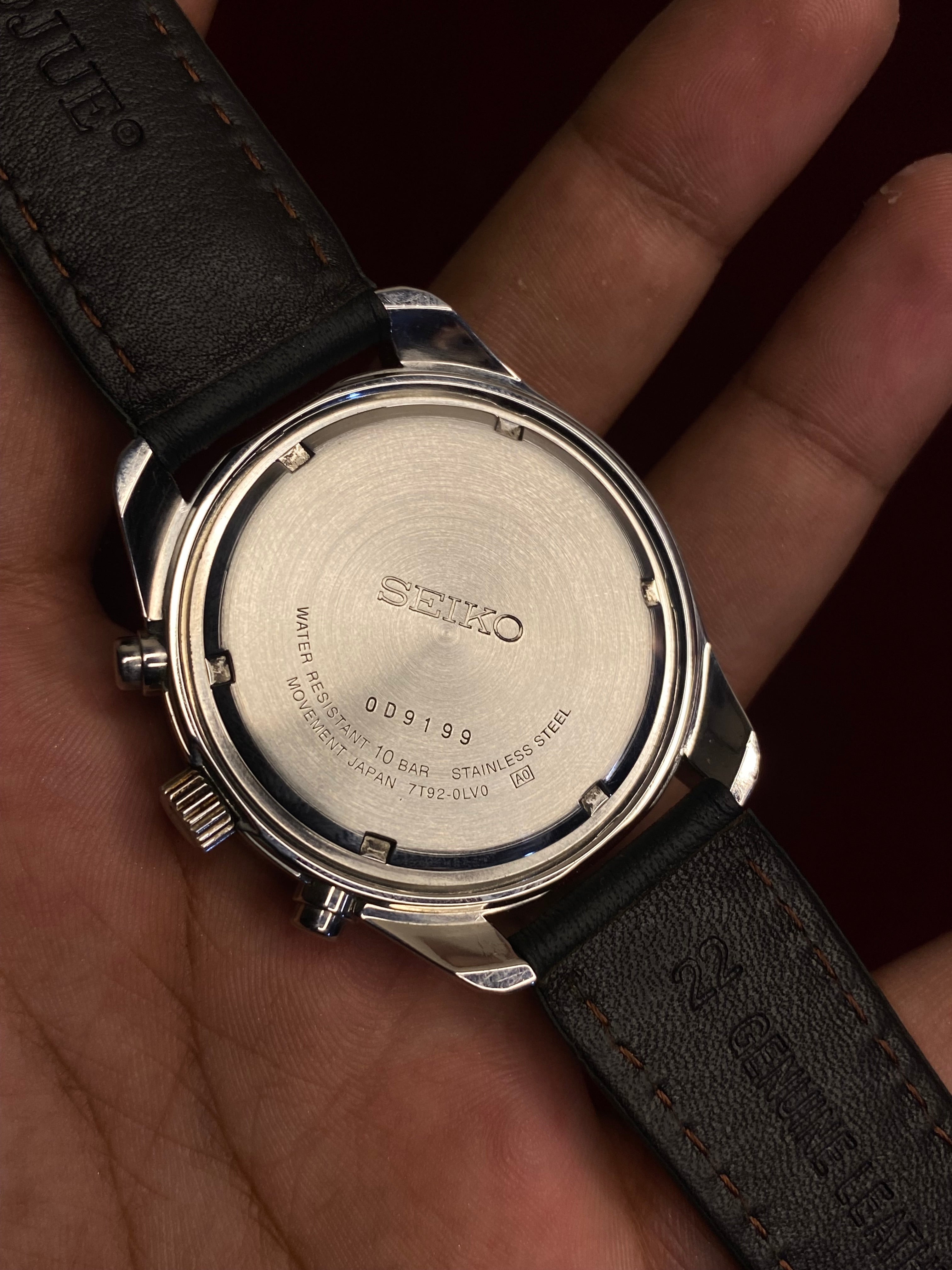 Seiko 7T92 Chronograph — Black Dial with three sub-dials and a black leather strap.

100m water resistance.