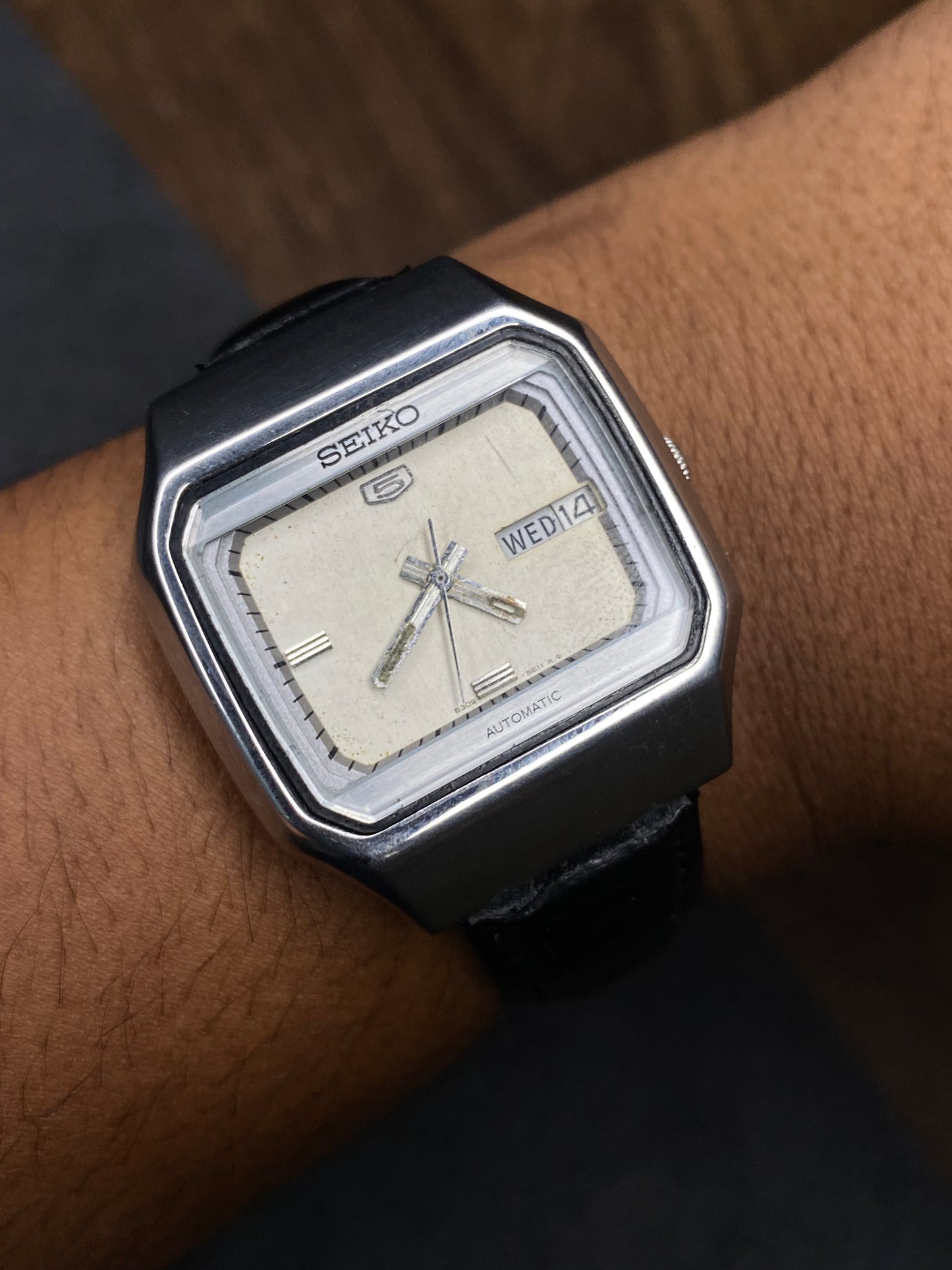 Vintage 1980s Seiko 5 Light Silver Tv Dial Automatic Watch with Black Leather Strap.