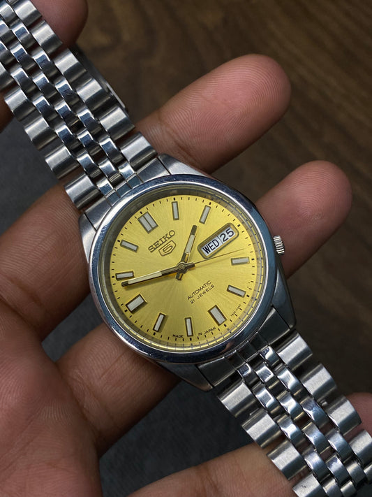 Beautiful Seiko 5 SNXS81 Golden Dial Watch With jubilee bracelet & See-Through Back