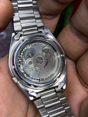 Seiko 5 “Clean Slate” — 7S26 White Dial Exhibition Automatic watch.