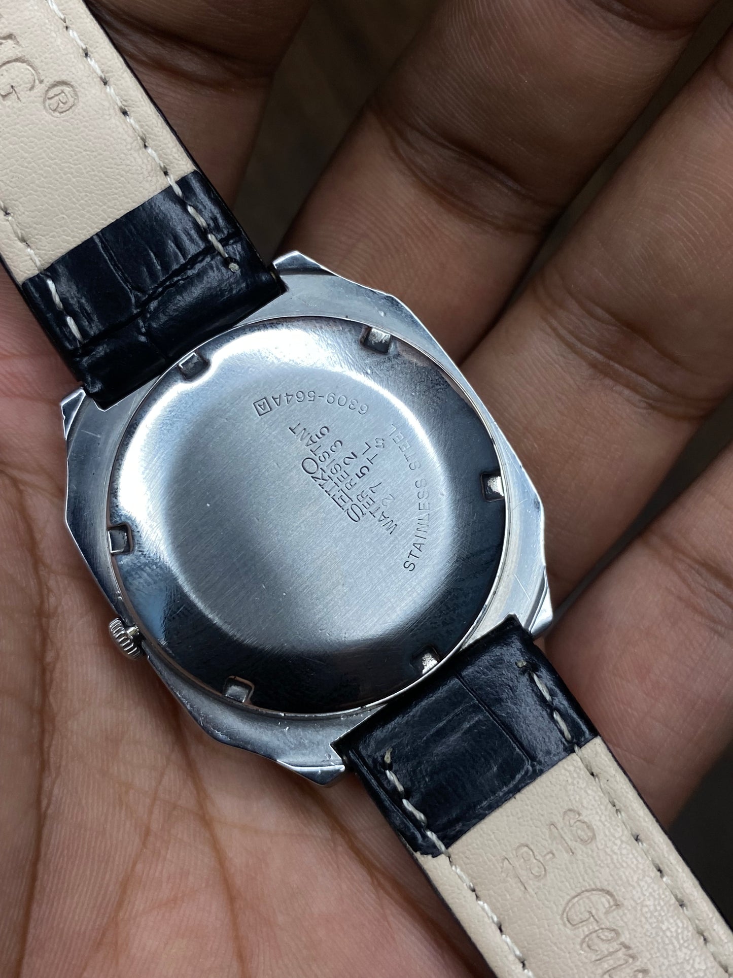 Vintage 1980s Seiko 5 Light Silver Tv Dial Automatic Watch with Black Leather Strap.
