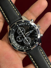 Seiko 7T92 Chronograph — Black Dial with three sub-dials and a black leather strap.

100m water resistance.