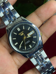 Seiko 5 SNKF67J1 Automatic — Black Sunburst Dial Watch with Exhibition Back | Ref 7S26-00X0.