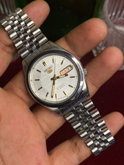 Seiko 5 Automatic — White Wave-Textured Dial watch with Exhibition Back | Ref 7S26-00X0