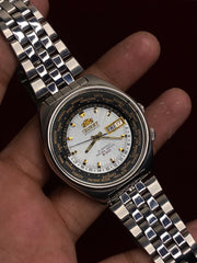 Orient World Time Automatic — Silver Sunburst Dial, 24-City Bezel | Ref. 469EE7-70 | 21 Jewels | 41mm.