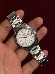 Seiko 5 SNX999 Automatic — White Dial with Concentric Ring Layout | Ref. 7S26-00X0 | Exhibition Caseback | 38mm