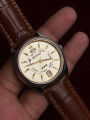 Orient 3-Star Crystal Automatic — Champagne Dial, Rotating Day Ring | Ref. EM5J-A0 | 21 Jewels | 38mm