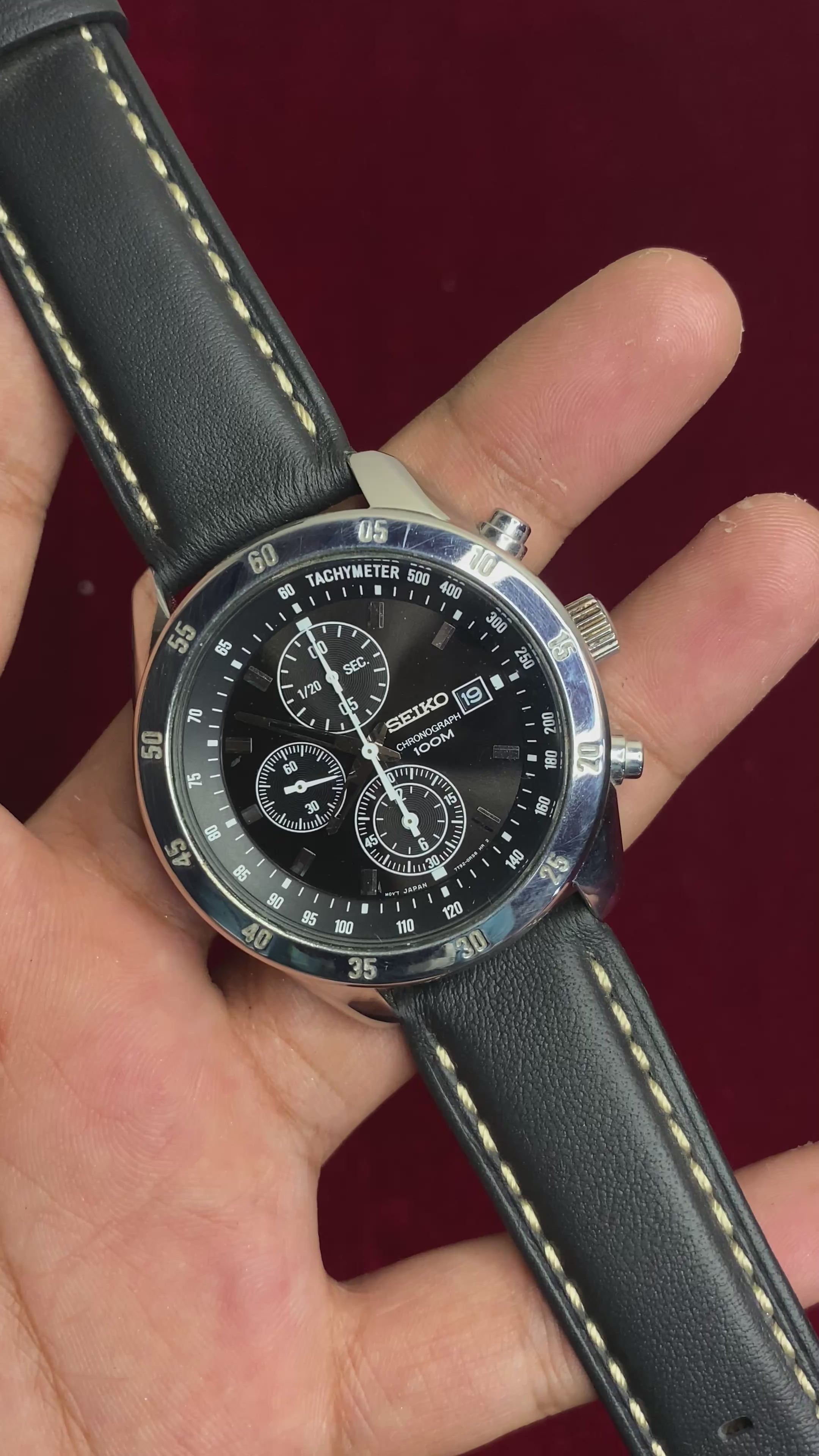 Seiko 7T92 Chronograph — Black Dial with three sub-dials and a black leather strap.

100m water resistance.