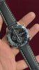 Seiko 7T92 Chronograph — Black Dial with three sub-dials and a black leather strap.

100m water resistance.